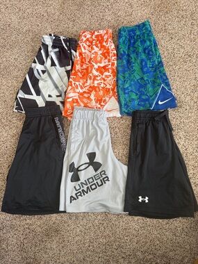 Nike and Under Armour boys athletic shorts lot. Includes 6 pair. Sz youth med.